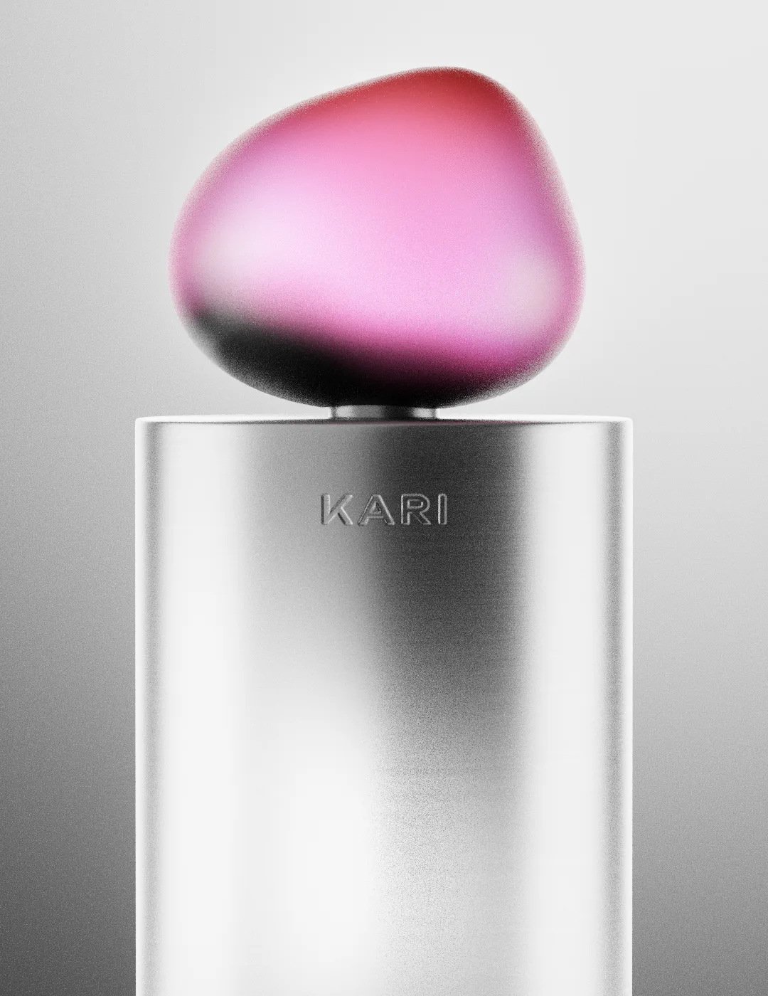 KARI perfume bottle with metallic body and pink organic-shaped cap