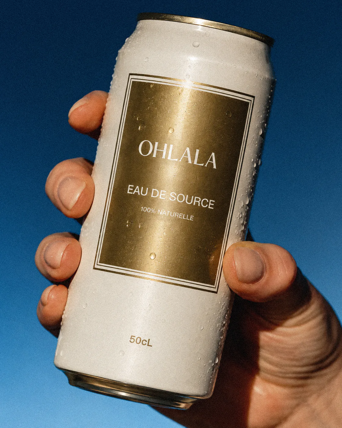 OHLALA French spring water can with gold label and luxury-inspired packaging